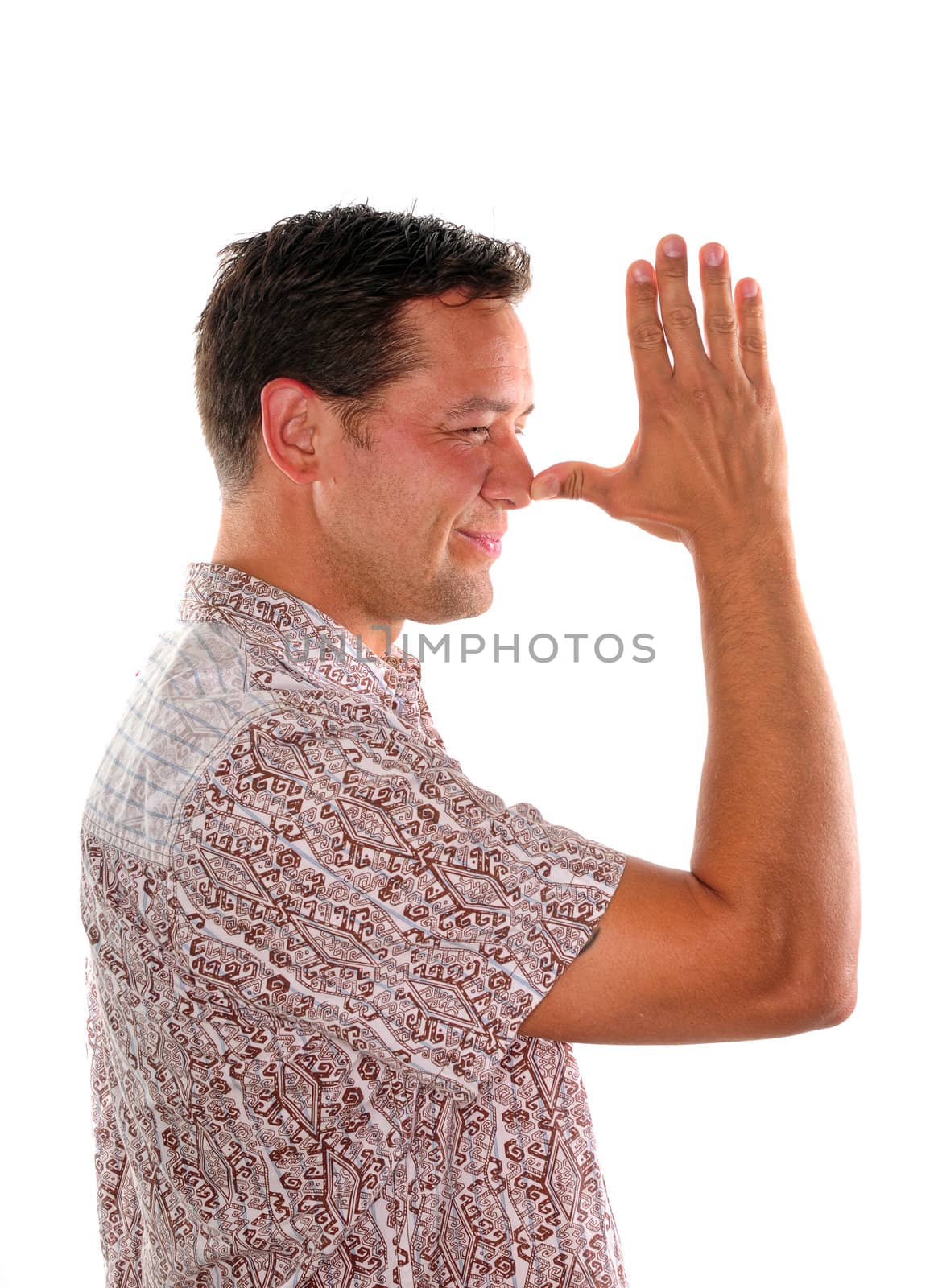 Young man being silly by making a face with funny hand gesture