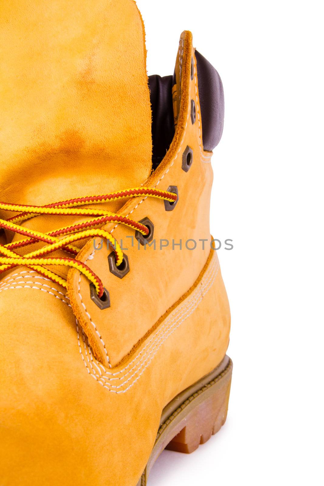 Yellow men's boots isolated on white background