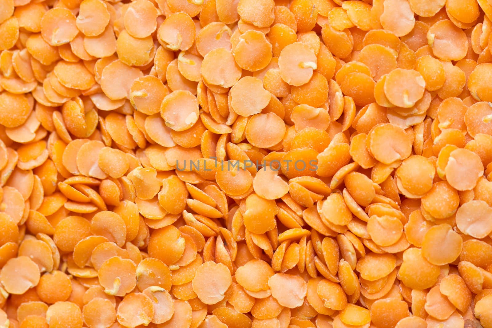 A background of raw red lentils