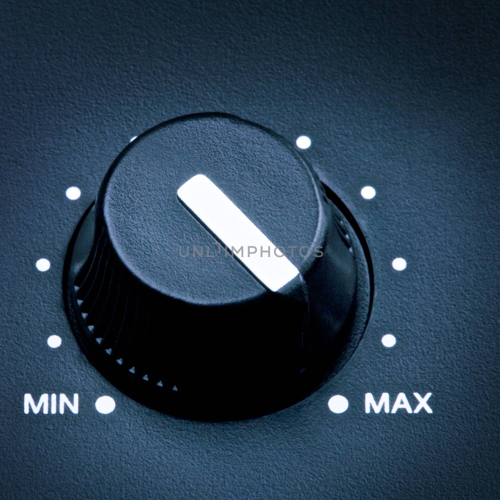 black olume knob on maximum, close up