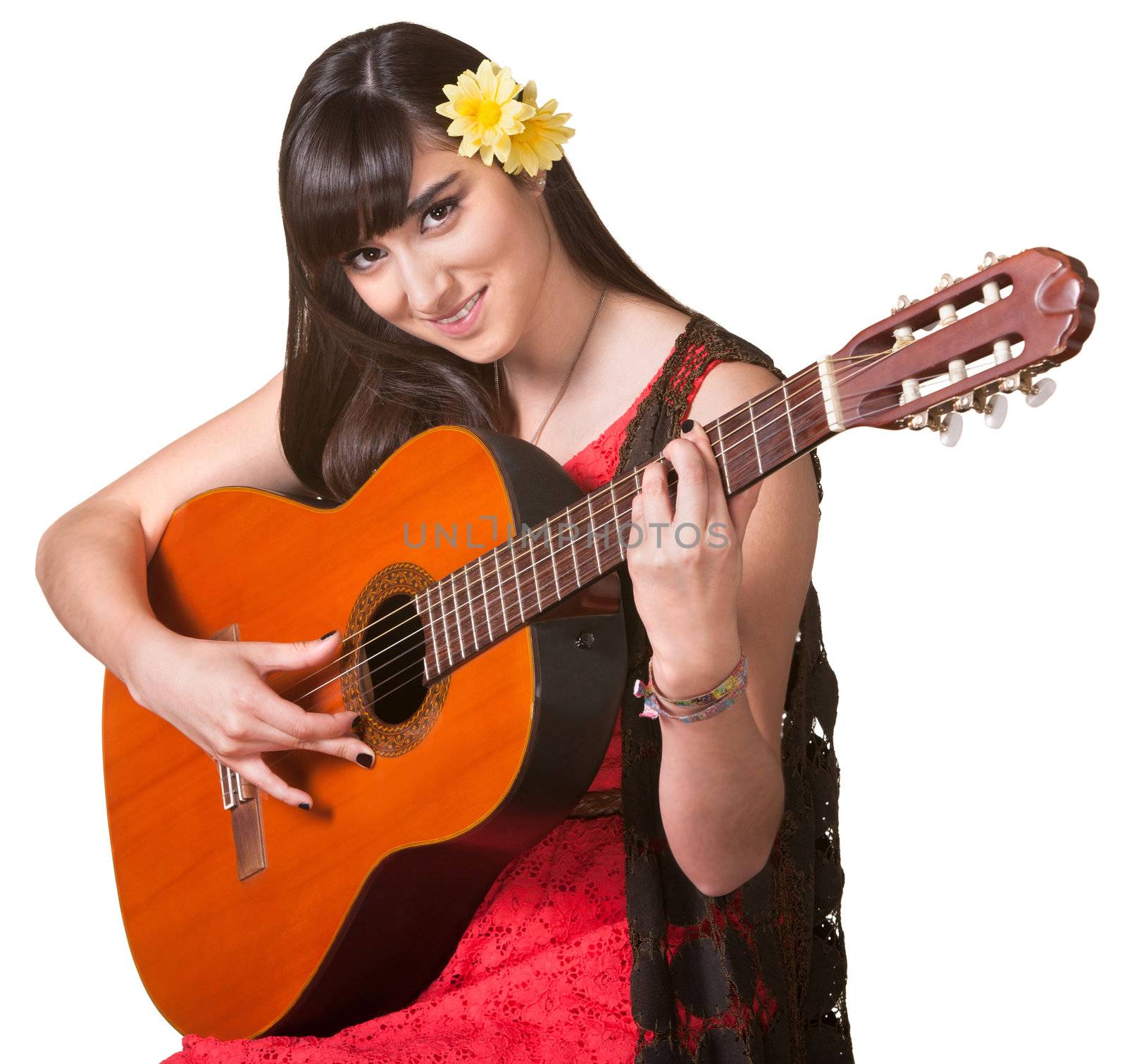 Pretty young woman playing a guitar over an isolated background