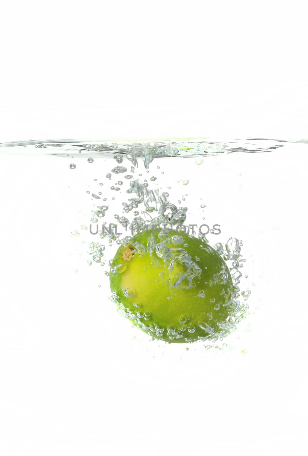 lime Making a splash while falling into clear water