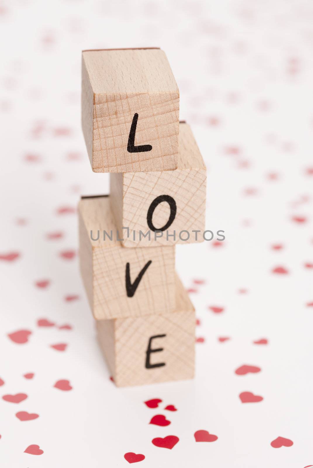 The word love constructed out ouf wooden blocks.