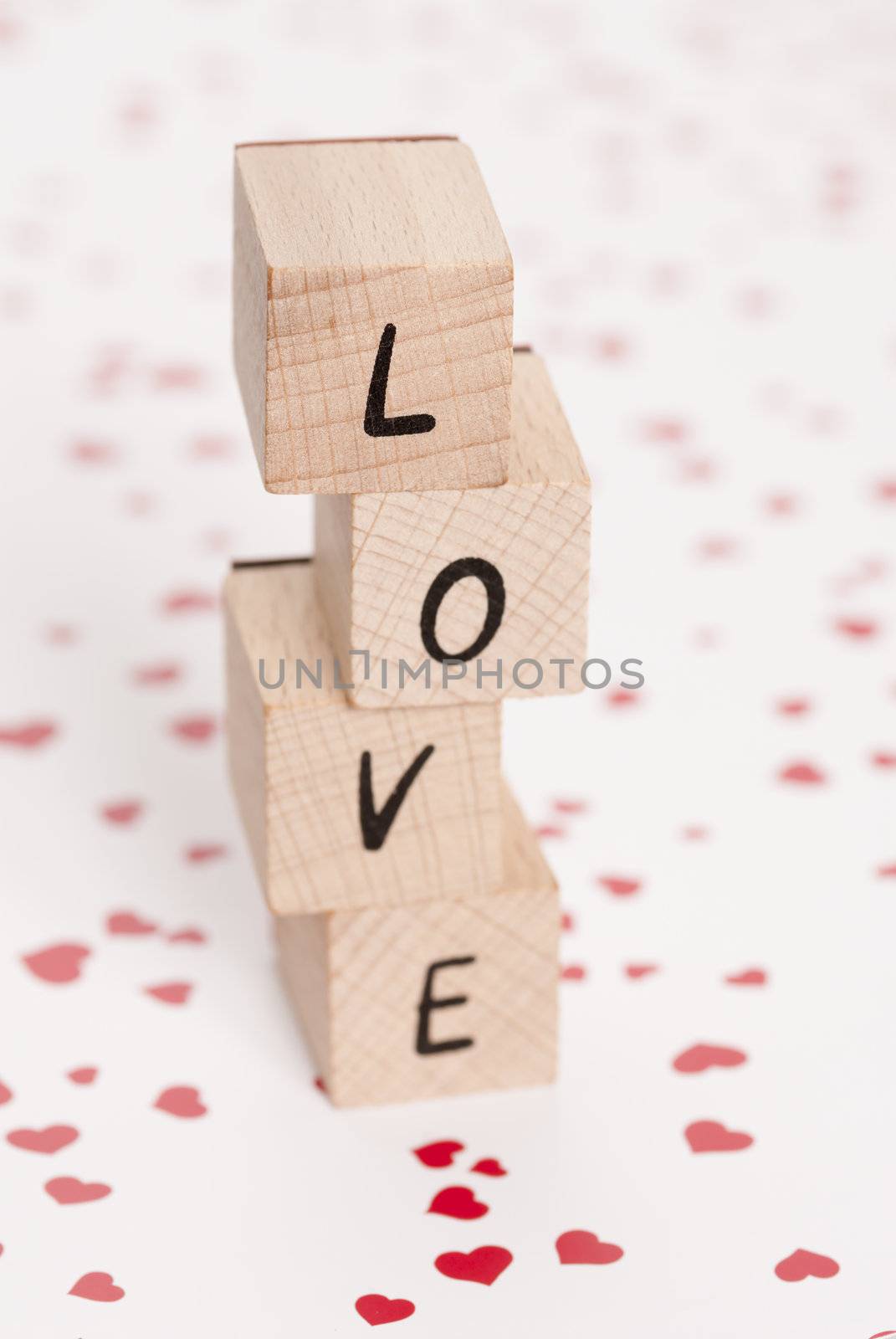 The word love constructed out ouf wooden blocks.