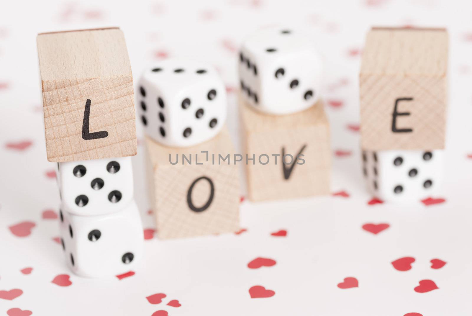 The word love alongside white dice.