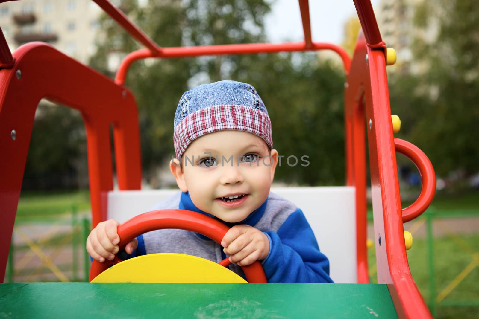 Boy Playing on Playground by petr_malyshev