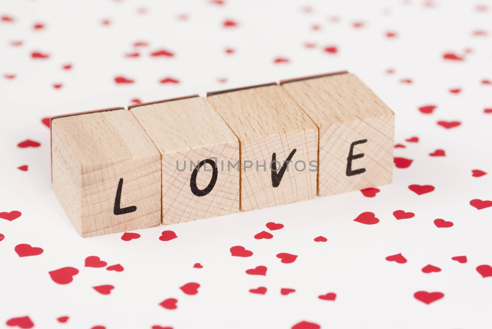 The word love constructed out ouf wooden blocks.