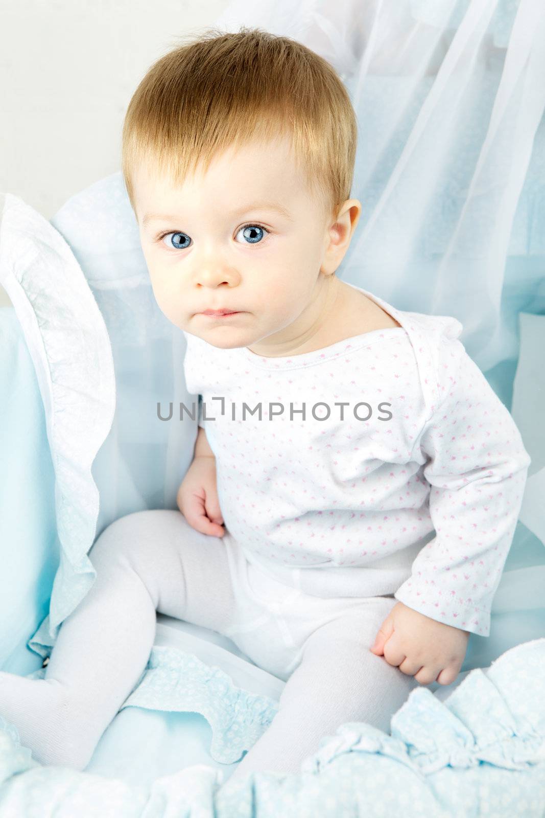 funny baby in cradle, happy and smiling