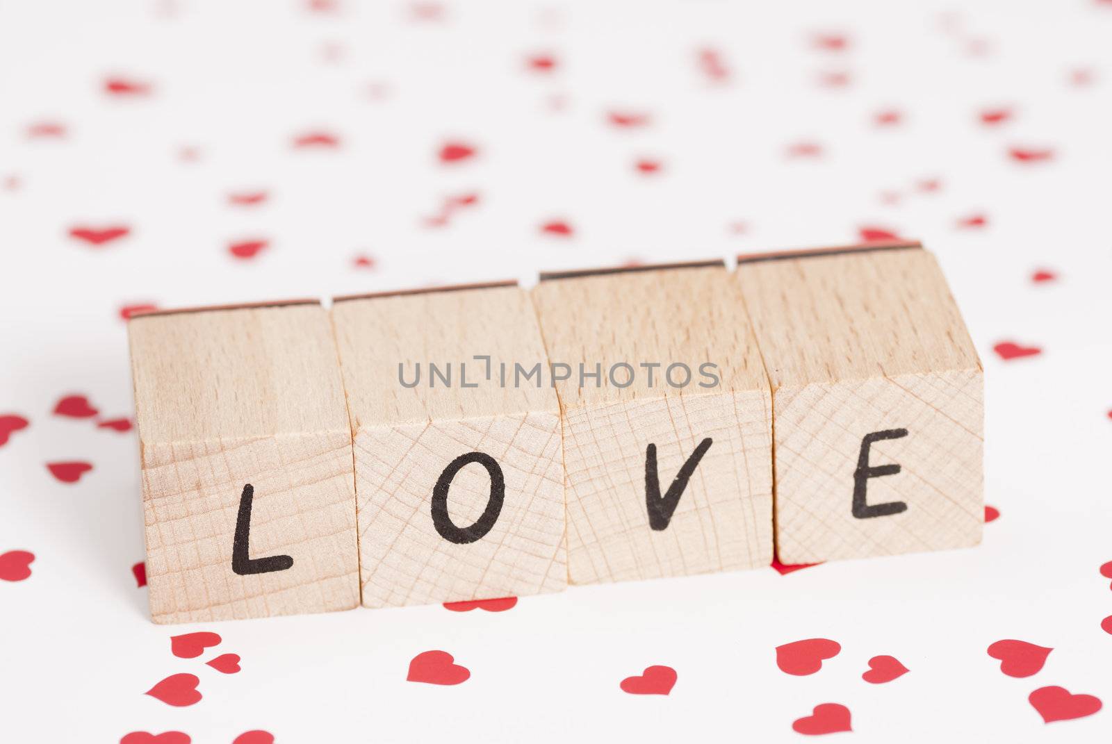 The word love constructed out ouf wooden blocks.