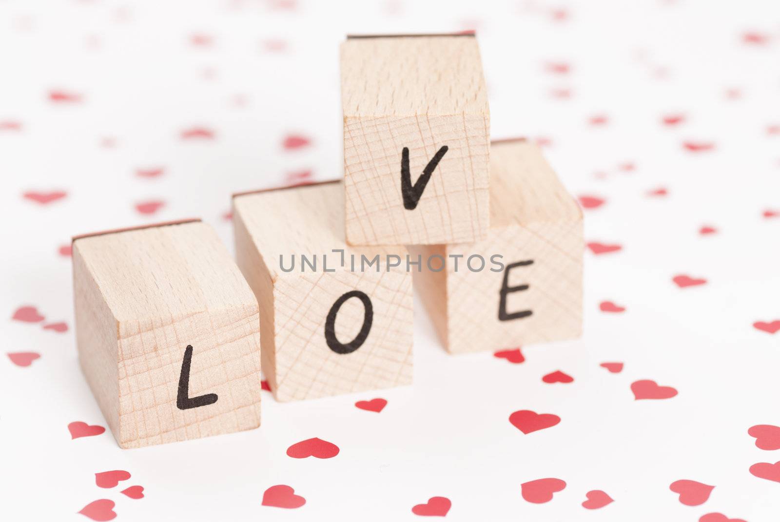 The word love constructed out ouf wooden blocks.