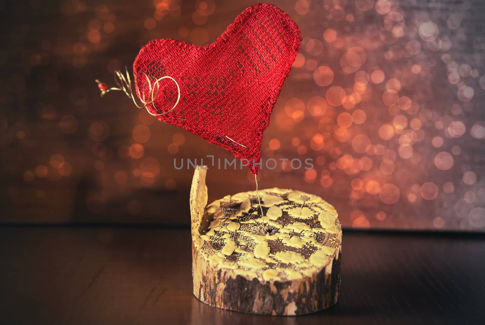 Red heart on a background of beautiful bokeh.