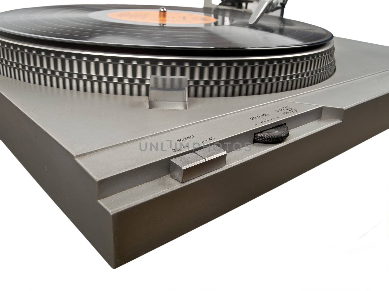 angle view of turntable and record playing on