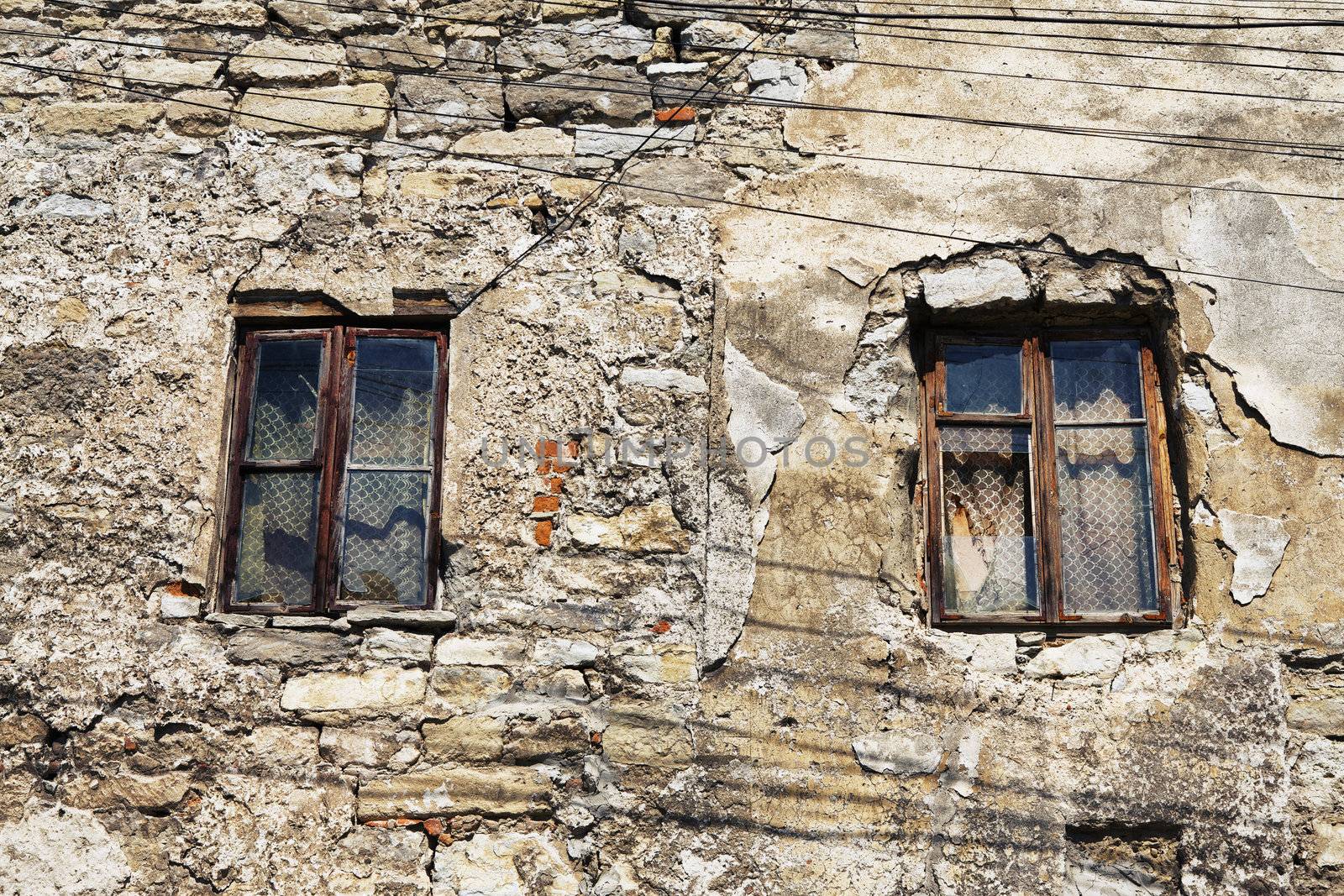 two window of abandoned house at day