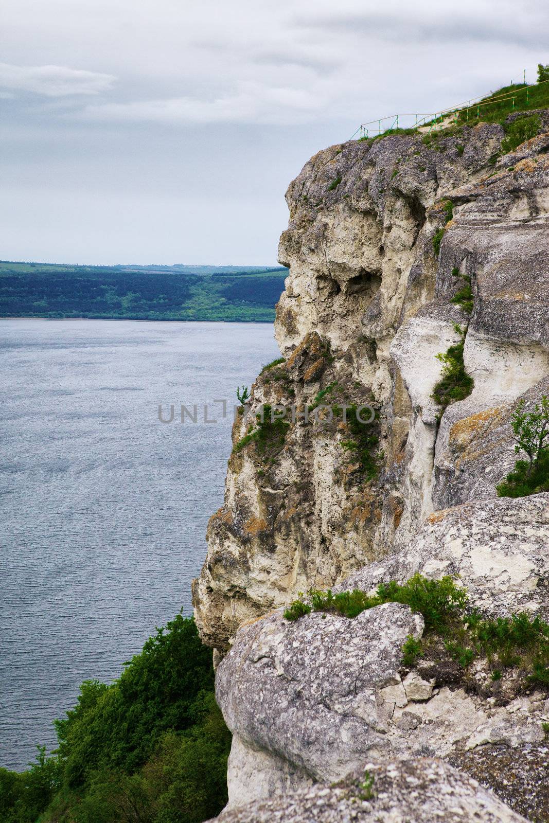 high rock over river at cloudy day, Dniester, Ukraine