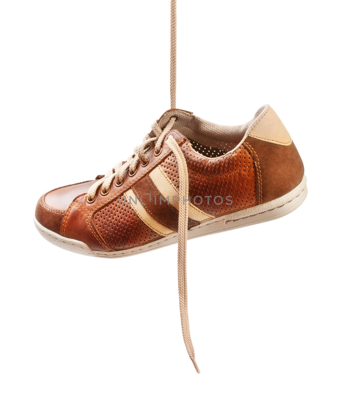 brown leather trainer shoe isolated on white