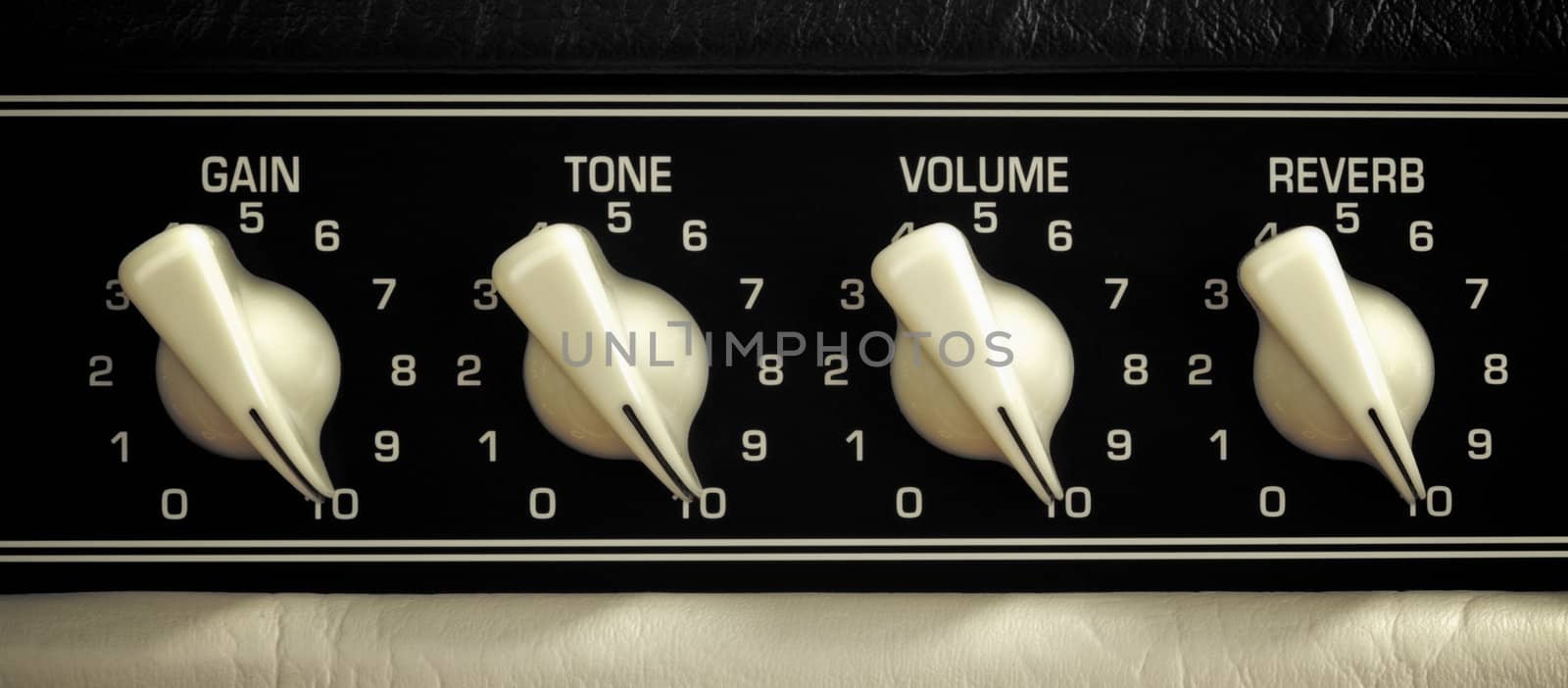 retro guitar amplifier control panel, maximum position, close up