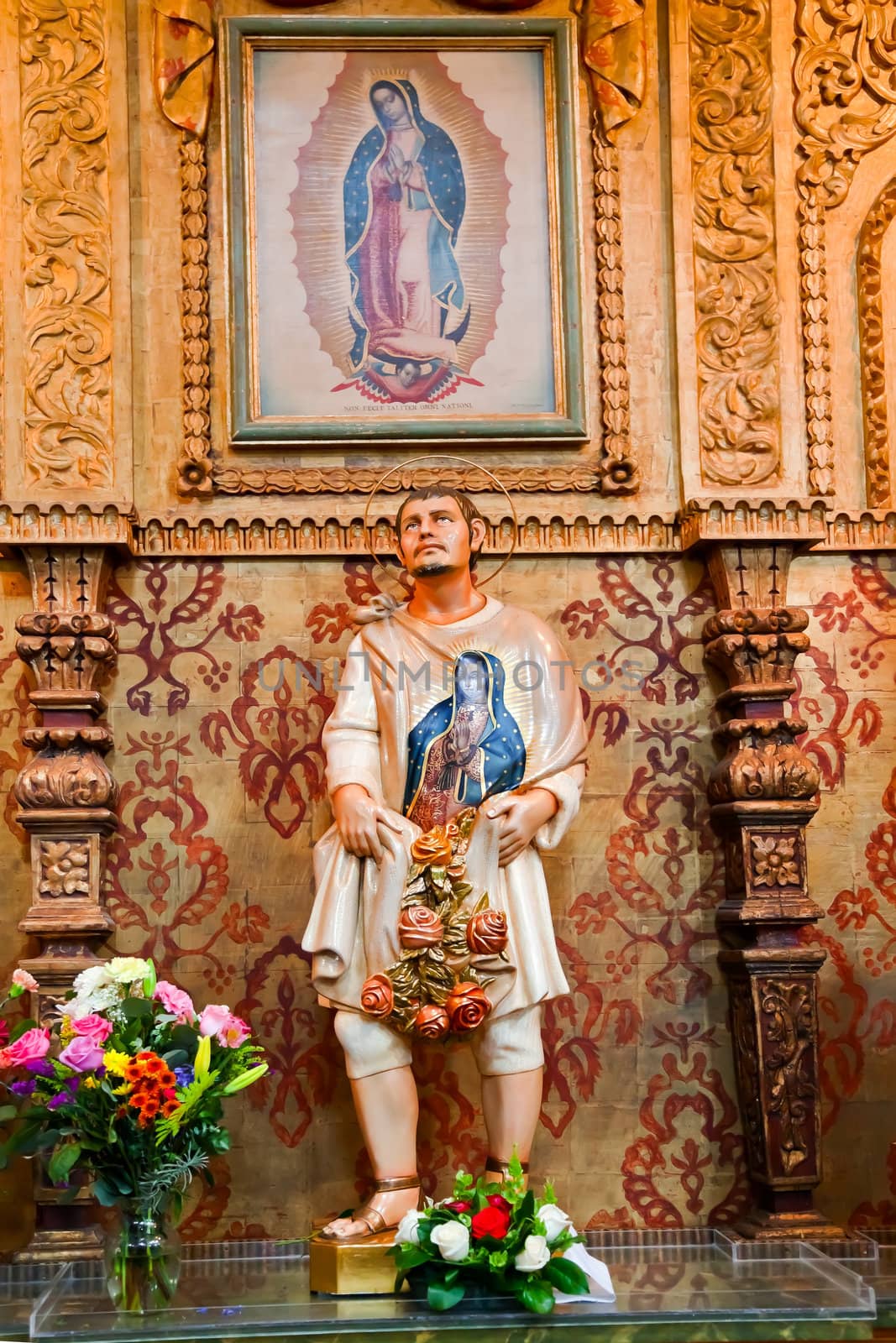 Guadalupe Shrine Mission Basilica San Juan Capistrano Church California. Mexican peasant Juan Diego Statue with Guadalupe on his tunic.