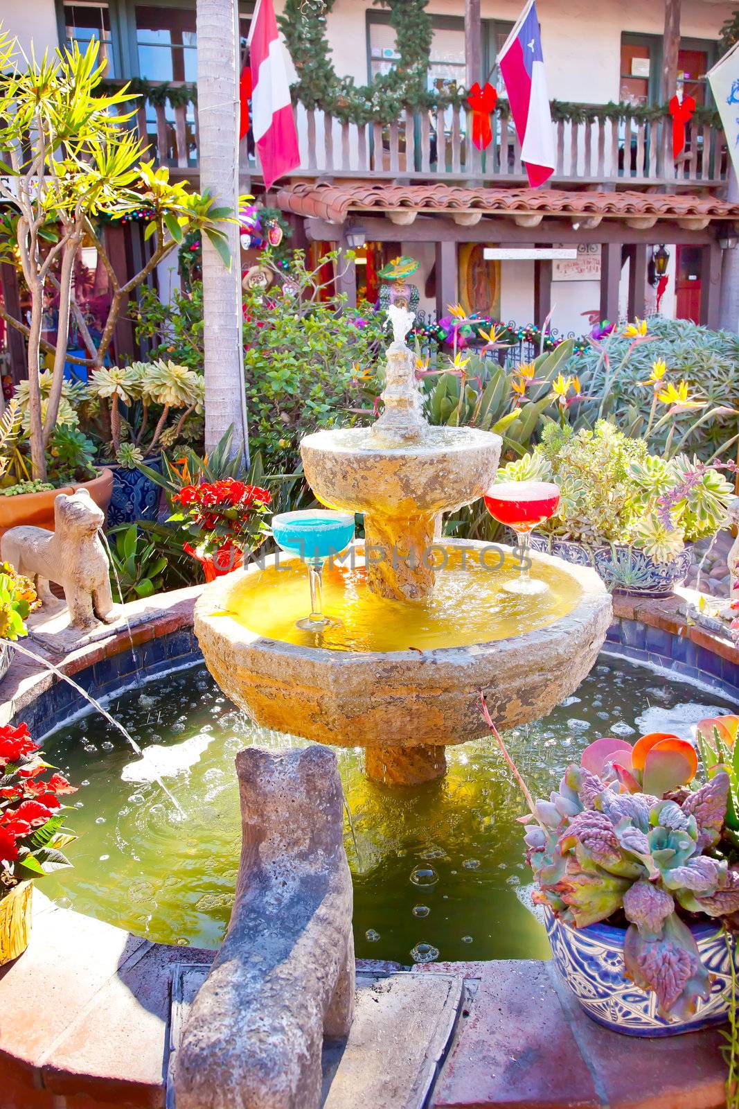 Fountain Margarita Glasses Flowers Garden Cactus Mexican Food Culture Old San Diego California Trademarks obscured.