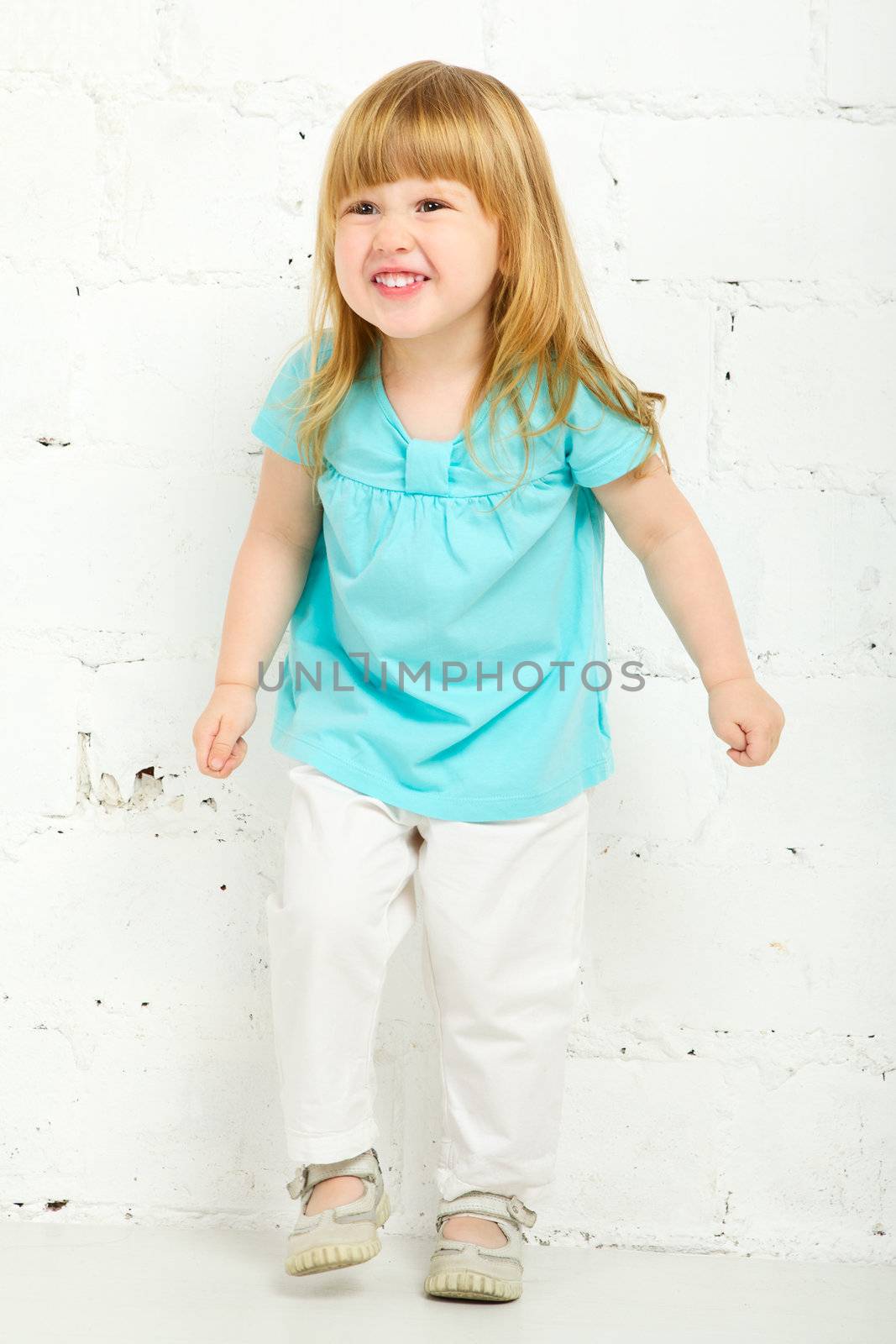 beautiful little girl playing and laughing, portrait