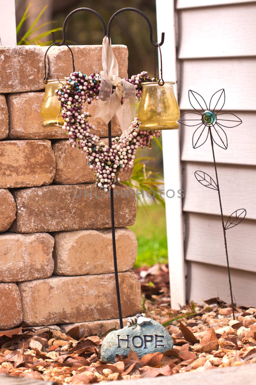 Decoration in the front door region , a heart made for birds to drink