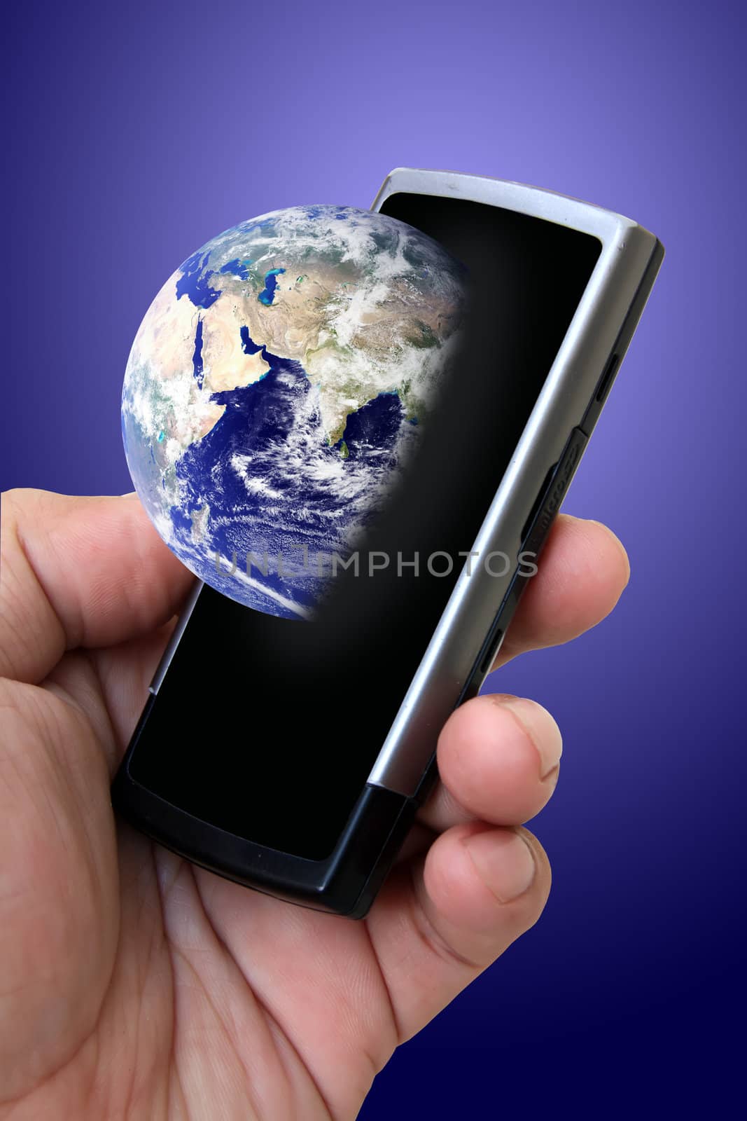 Hand holding mobile phone with earth globe