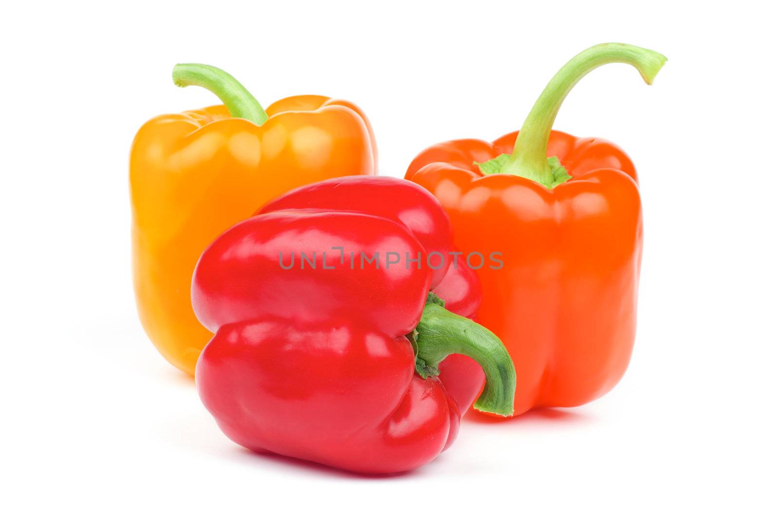 Red, Orange and Yellow Bell Peppers isolated on white background