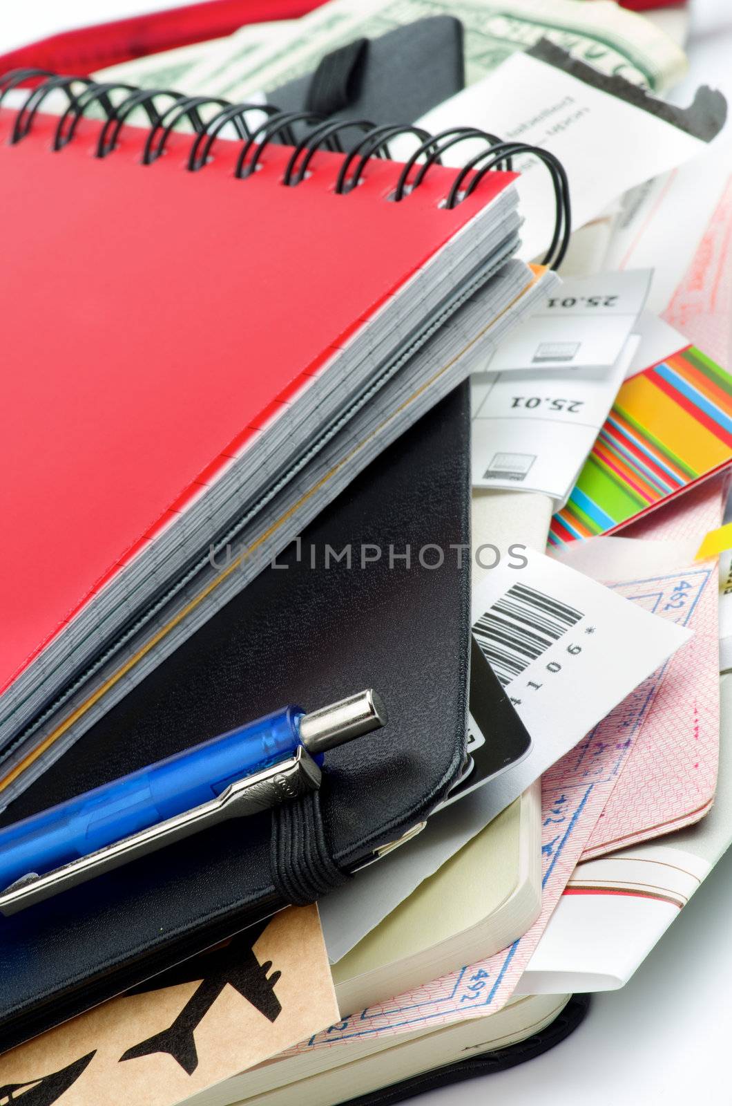 Arrangement of Travel Concept Objects with Planning, Tickets, Currency, Pen and Other Accessories closeup