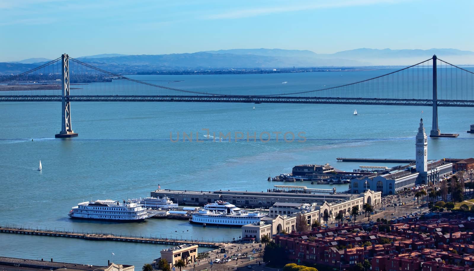 Bay Bridge and Ferry Terminal Boats and Apartment Buildings from Coit Tower San Francisco California on Telegraph Hill.