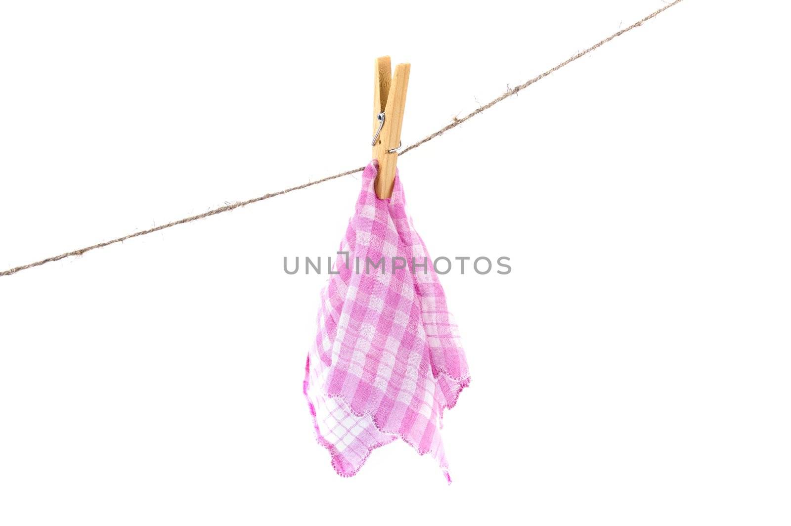 pink handkerchief drying on a rope by Triphka