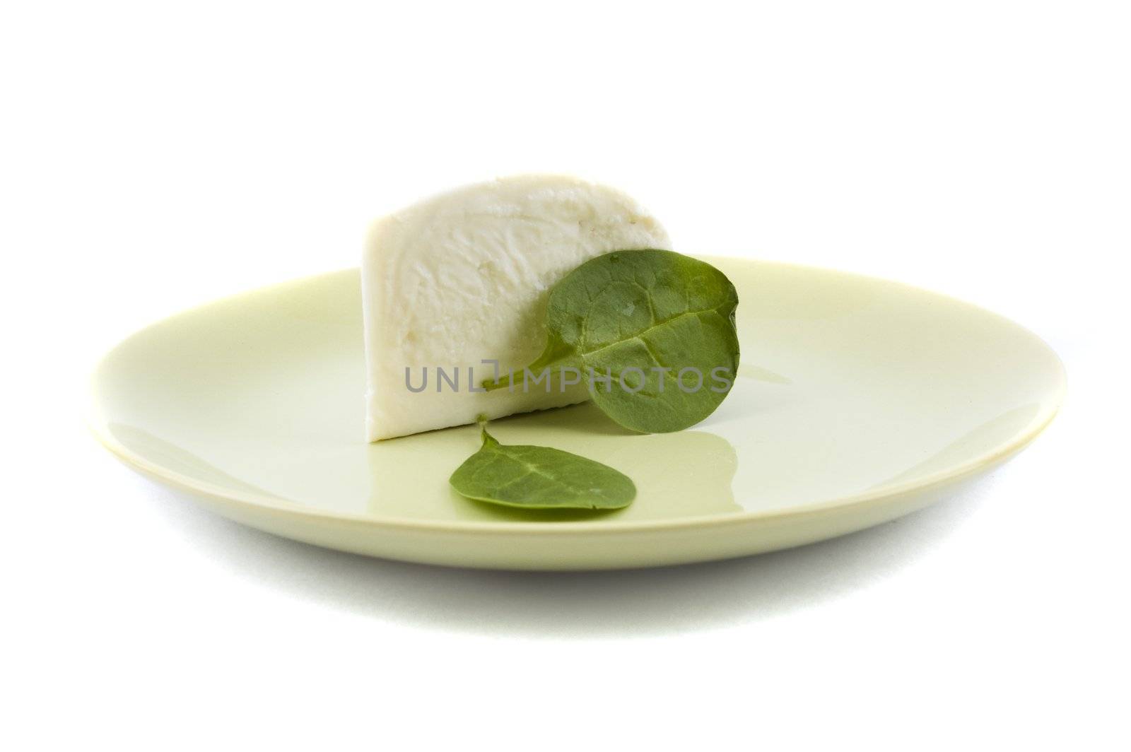 cheese and spinach on a green plate