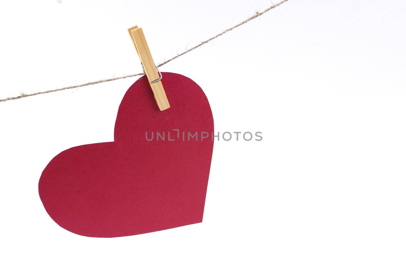 red paper heart on a clothespin by Triphka