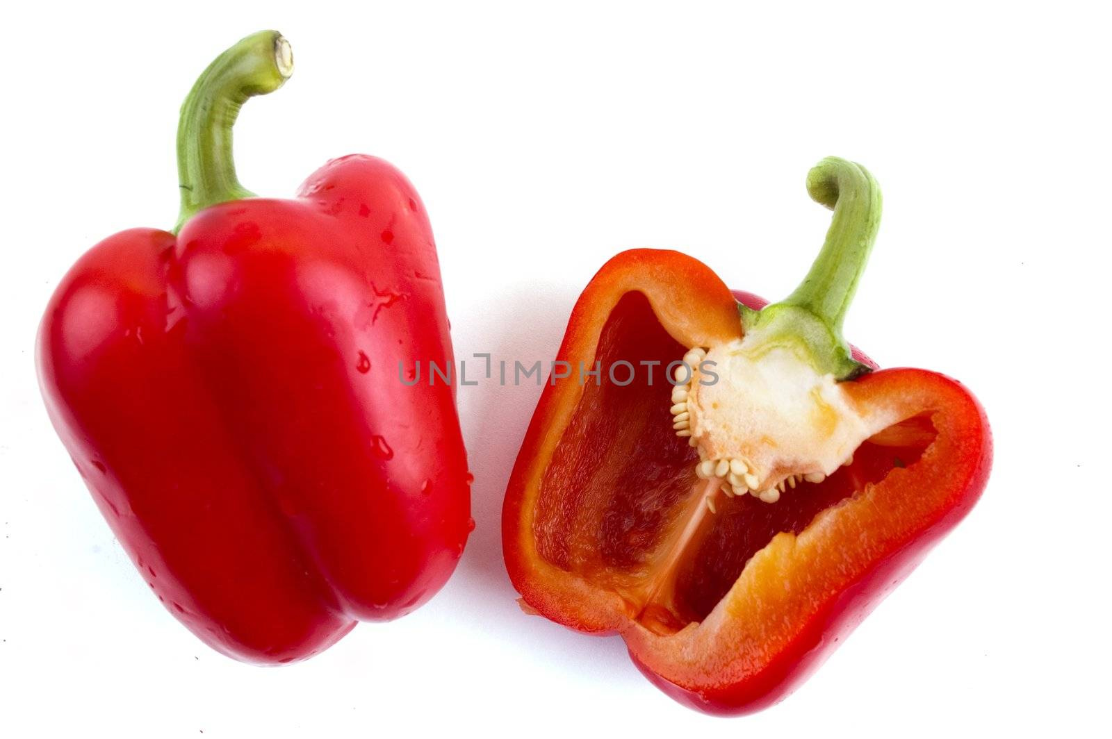 a red pepper and half of the pepper by Triphka