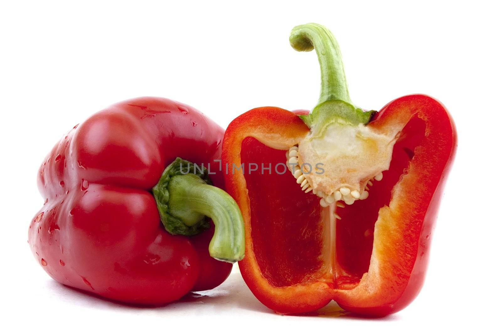 a red pepper and half of the pepper by Triphka