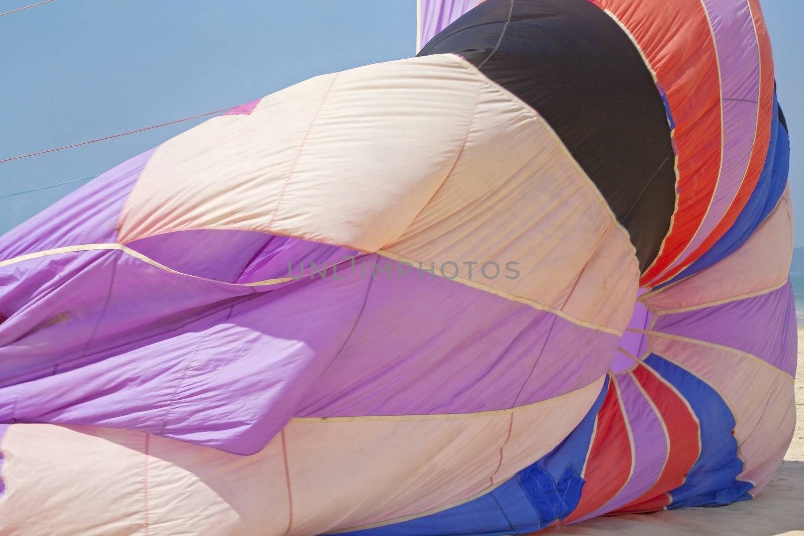 Generic horizontal landscape abstract colors of a para sail filling with wind making ready for a glide. Shot location Goa India