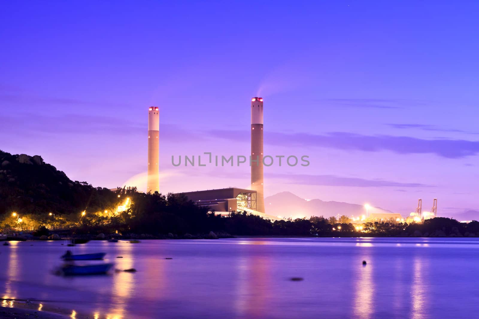 Power plant along coast at sunset