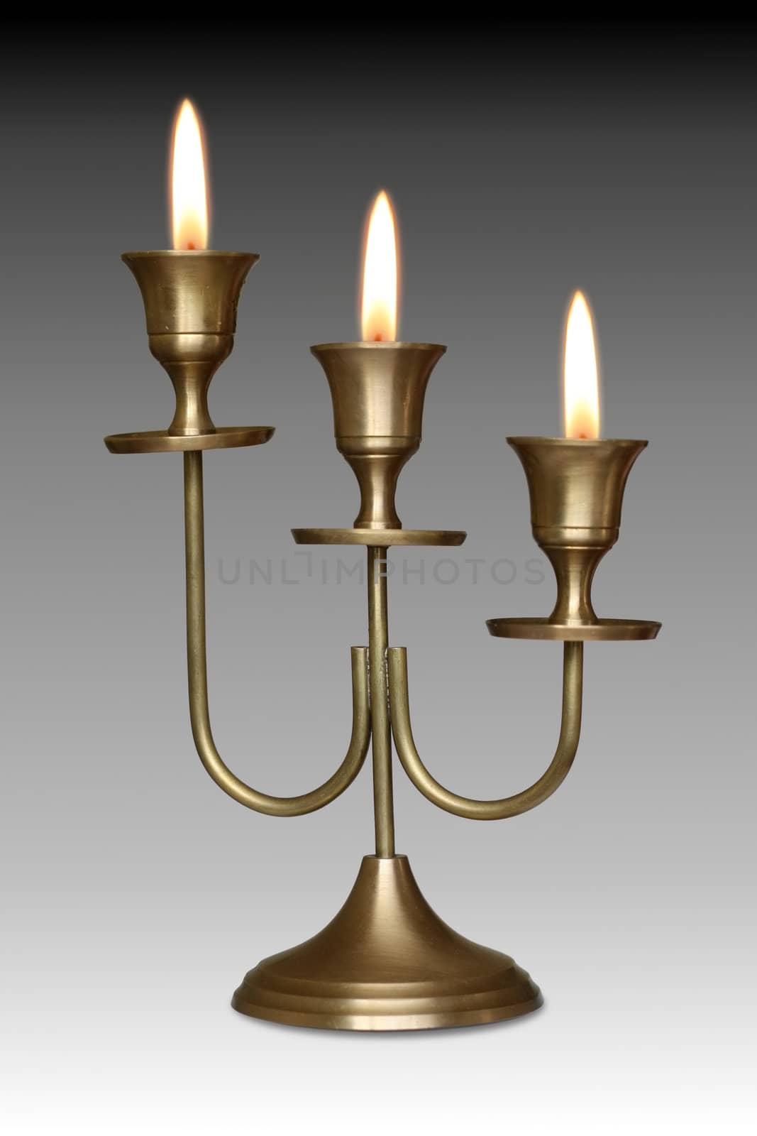 Three - branched candlestick and Votive Candles Burning