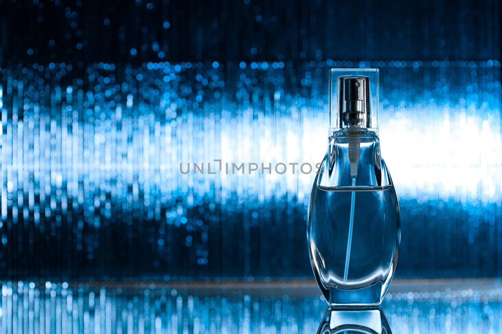 Perfume on abstract blue background