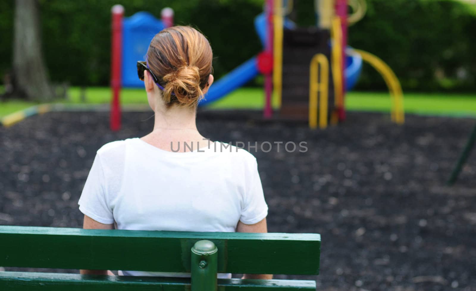 Woman sitting on a bench at a park by ftlaudgirl