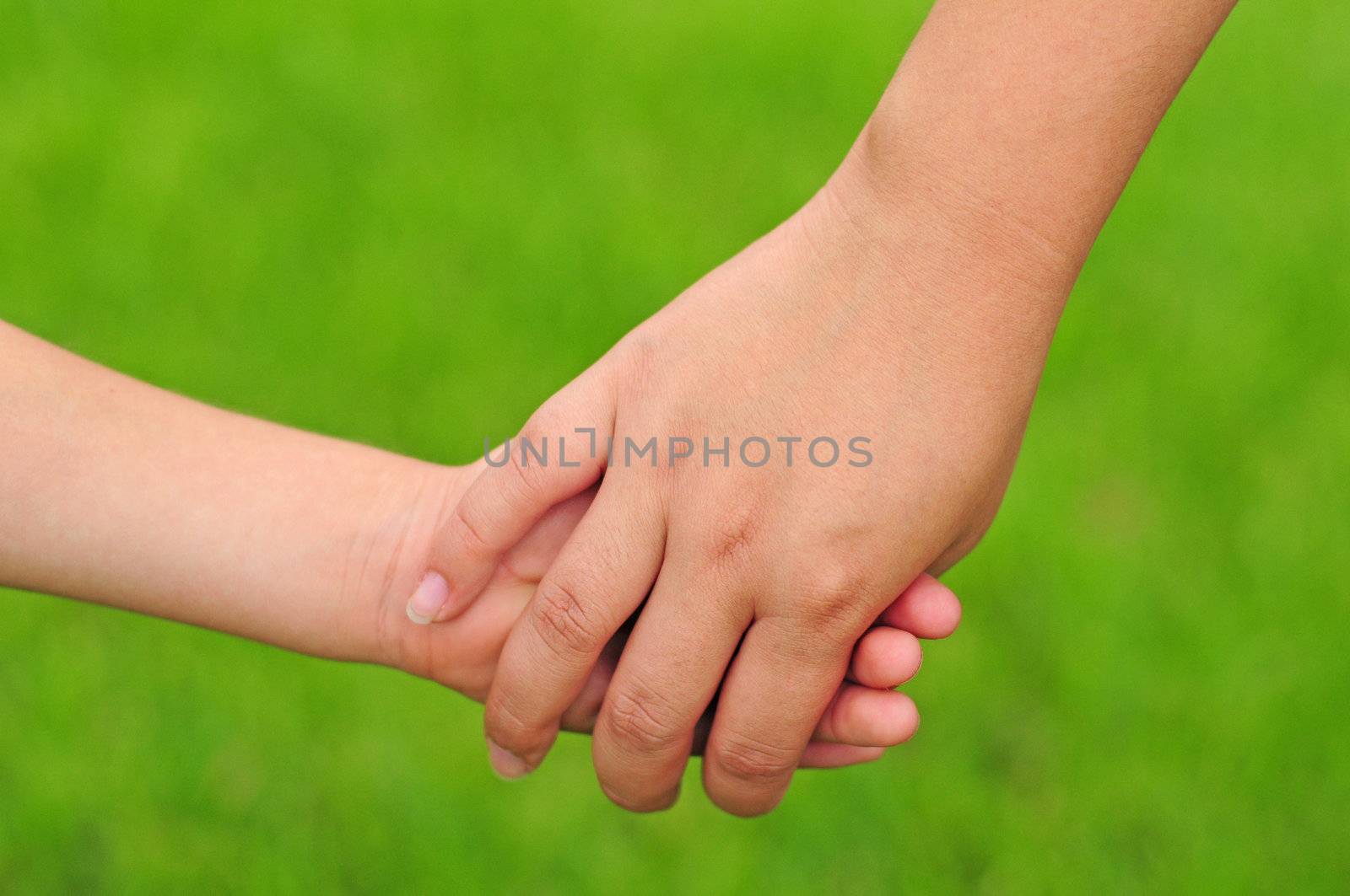 Mother holding hands with child by ftlaudgirl