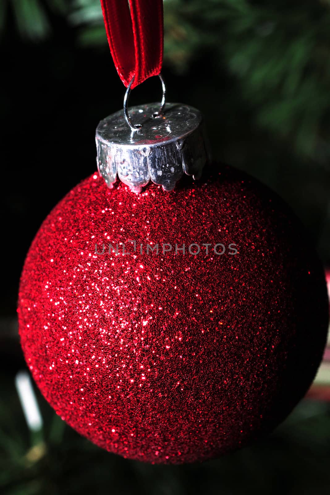 close up of a red glitter ornament for christmas