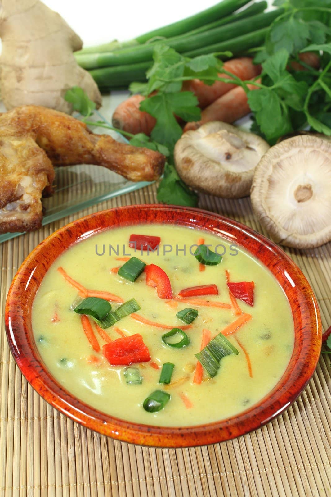 Curry soup with colorful vegetables and chicken