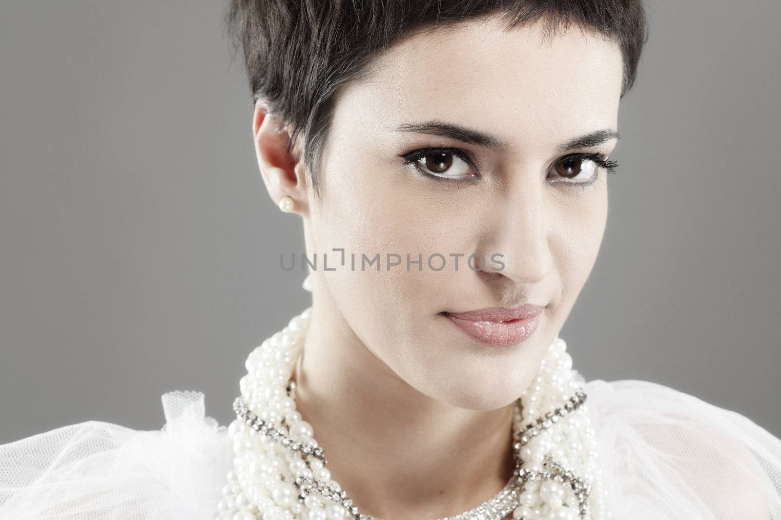 beautiful girl with short black hair, and pearl necklaces