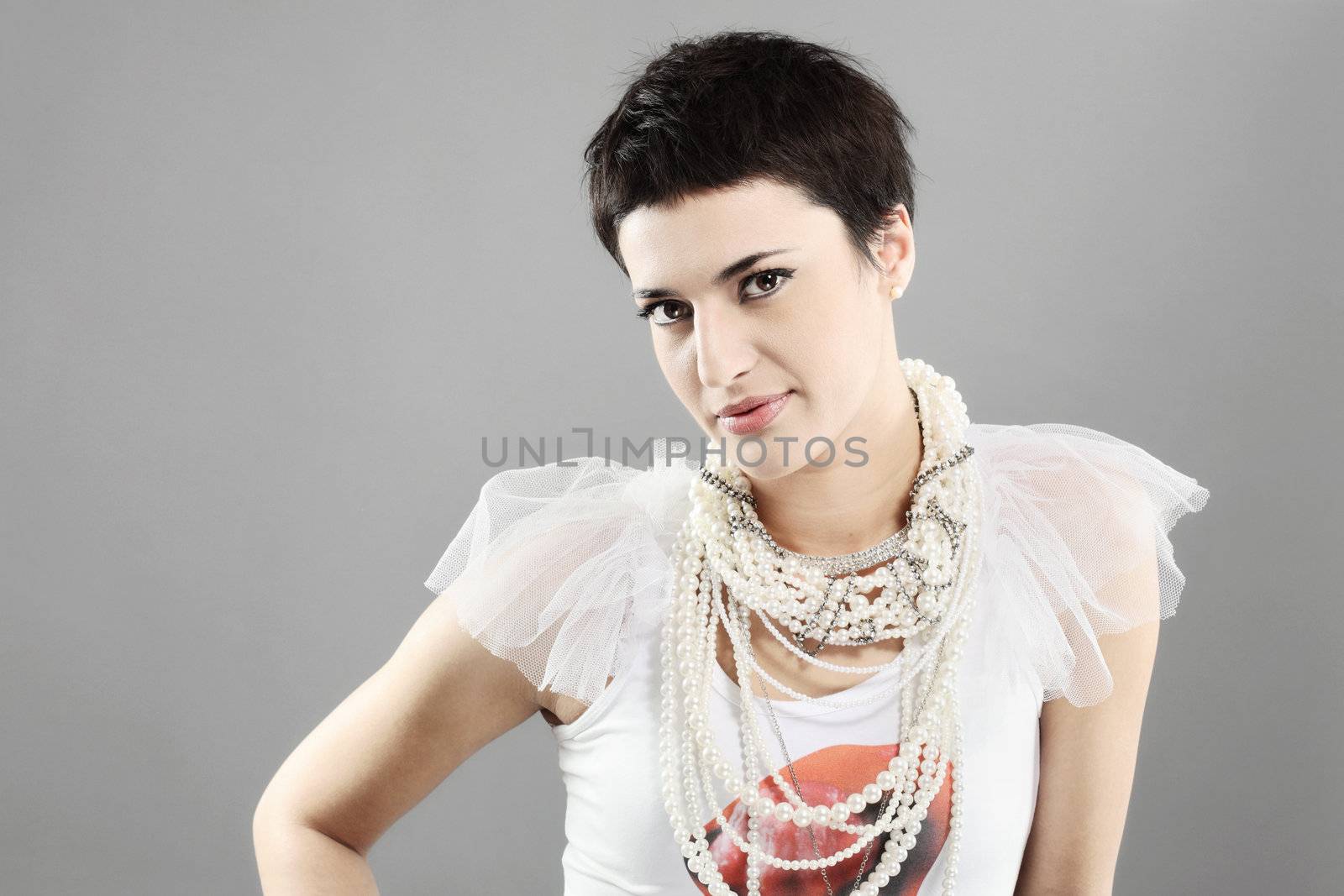 beautiful girl with short black hair, and pearl necklaces