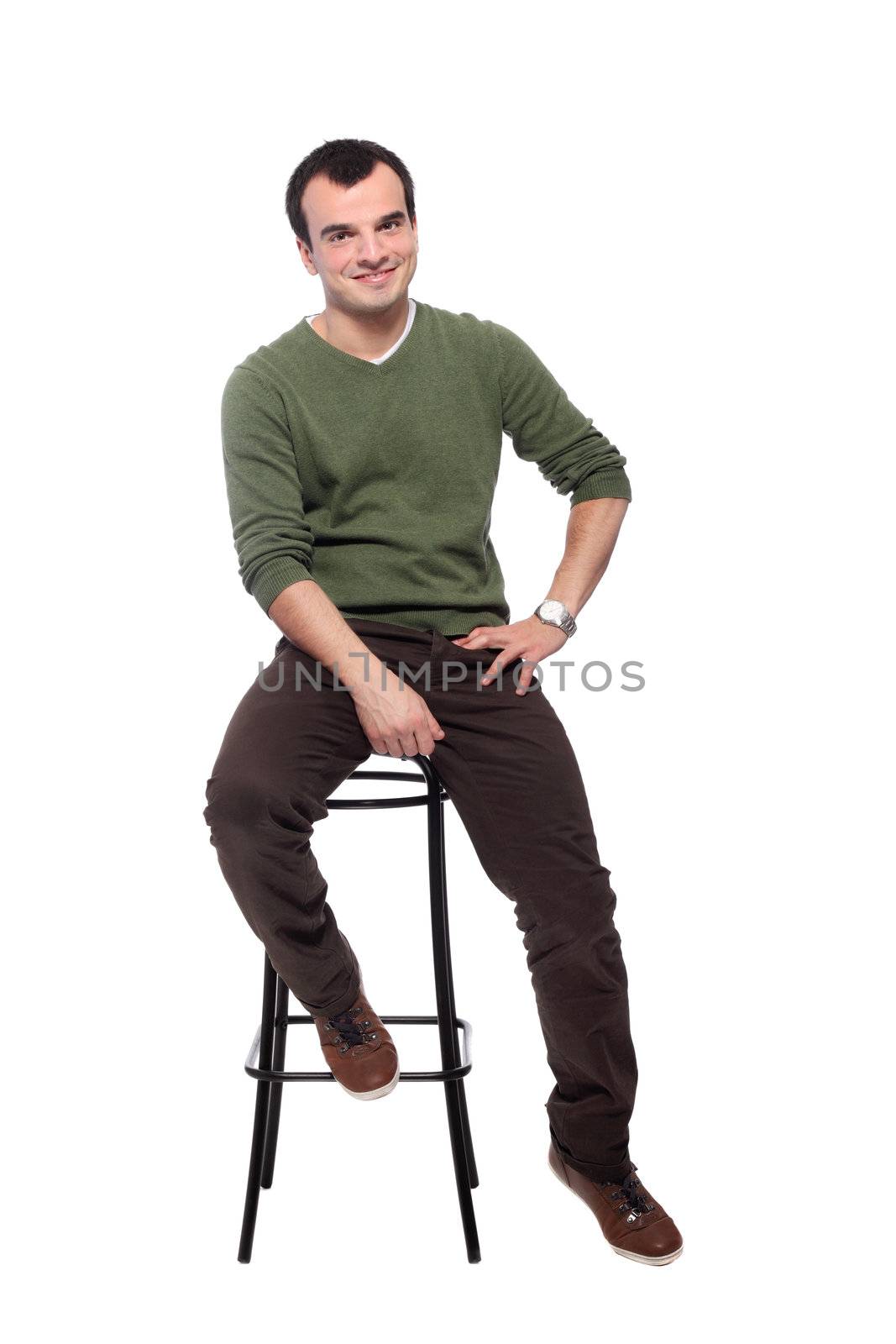 casual young adult on a chair, isolated on white