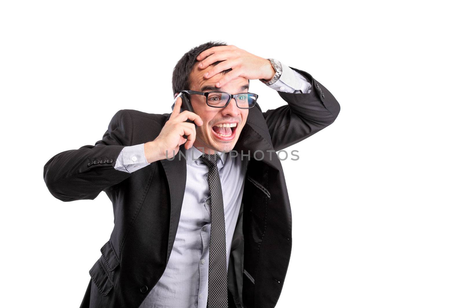 surprised businessman on the phone, isolated on white