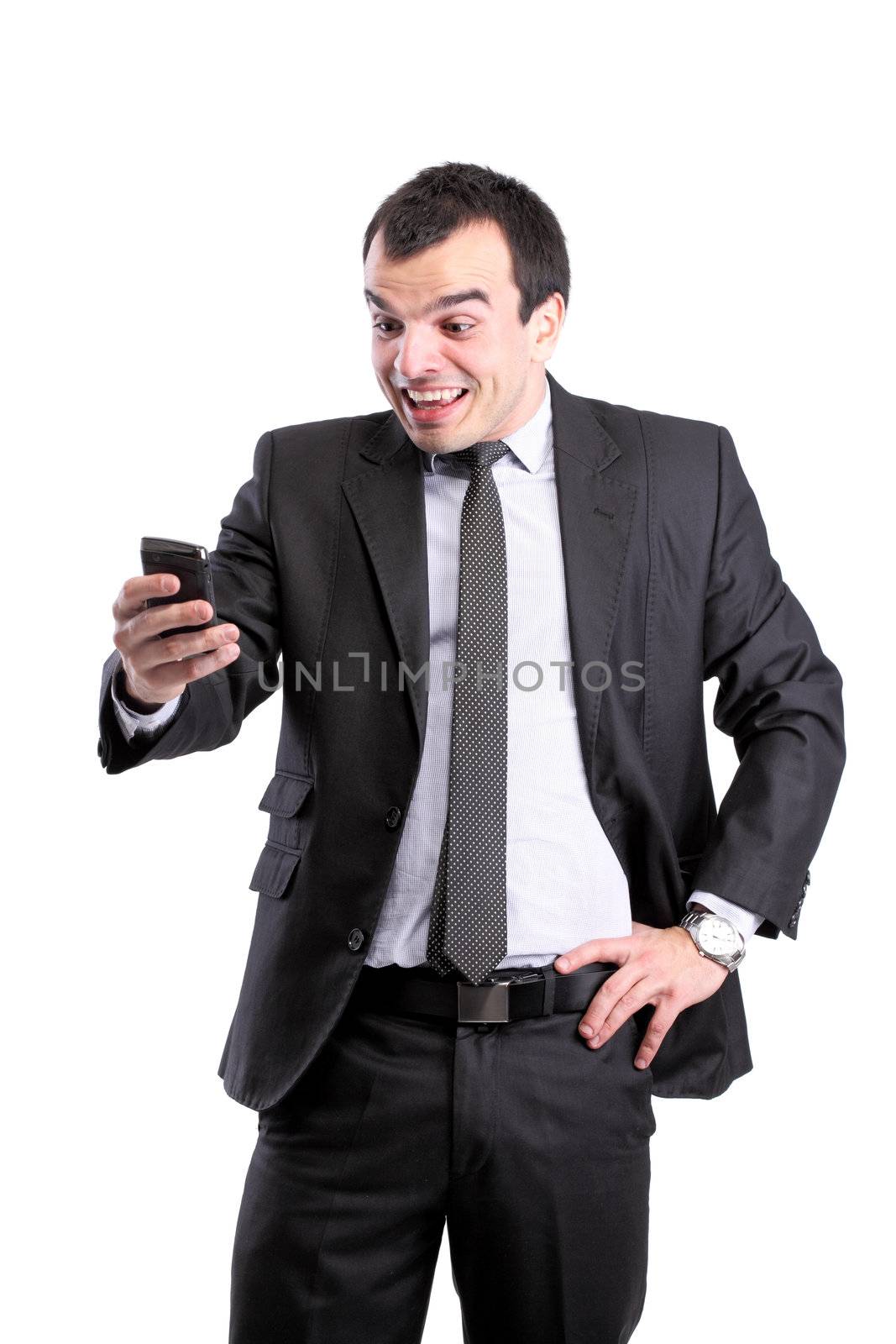 surprised businessman with a phone, isolated on white