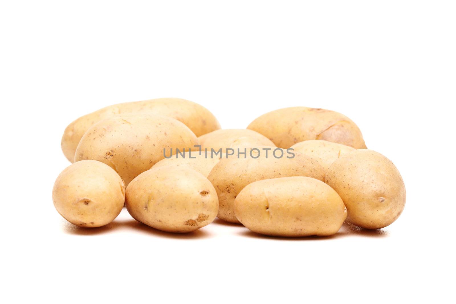 bunch of fresh potatoes against white