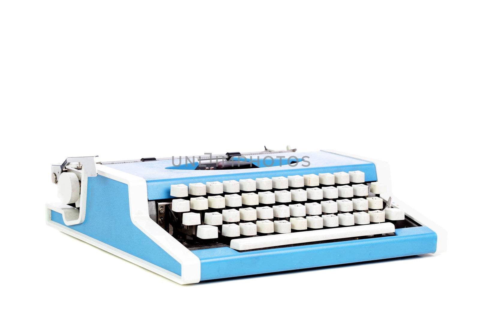old style typing machine against white background