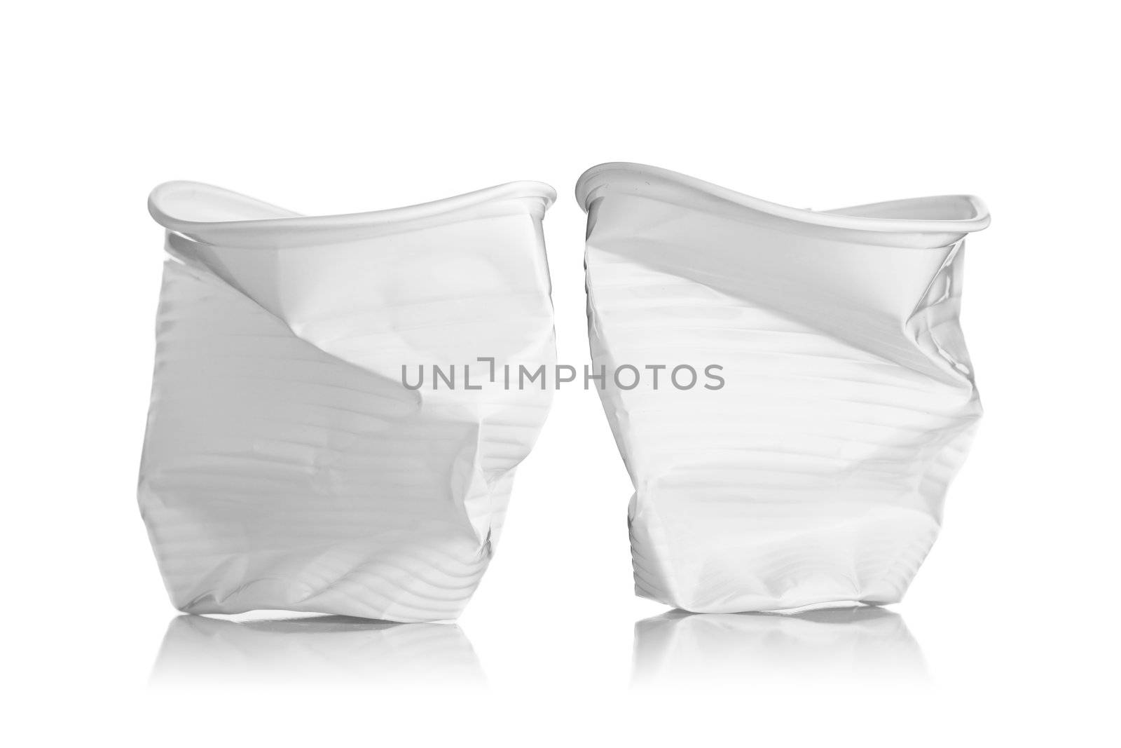 two smashed plastic cups, isolated on white background