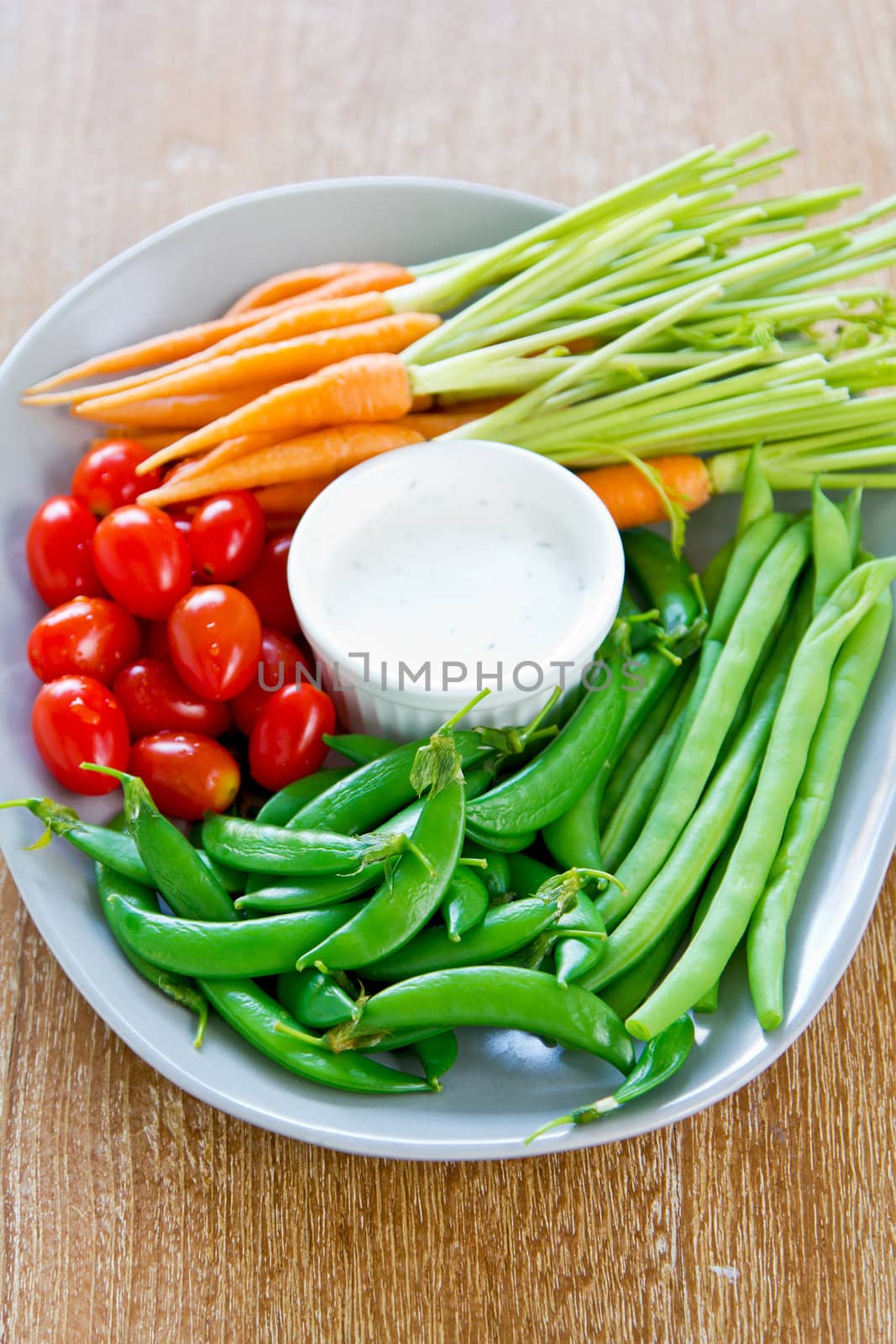 Fresh vegetables with dipping sauce by vanillaechoes